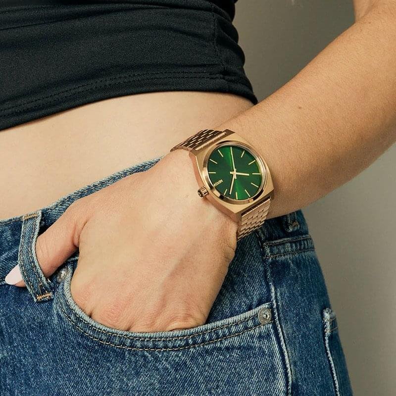 Nixon Time Teller Gold Green Sunray 37mm stainless steel quartz watch with green dial and 100m water resistance.