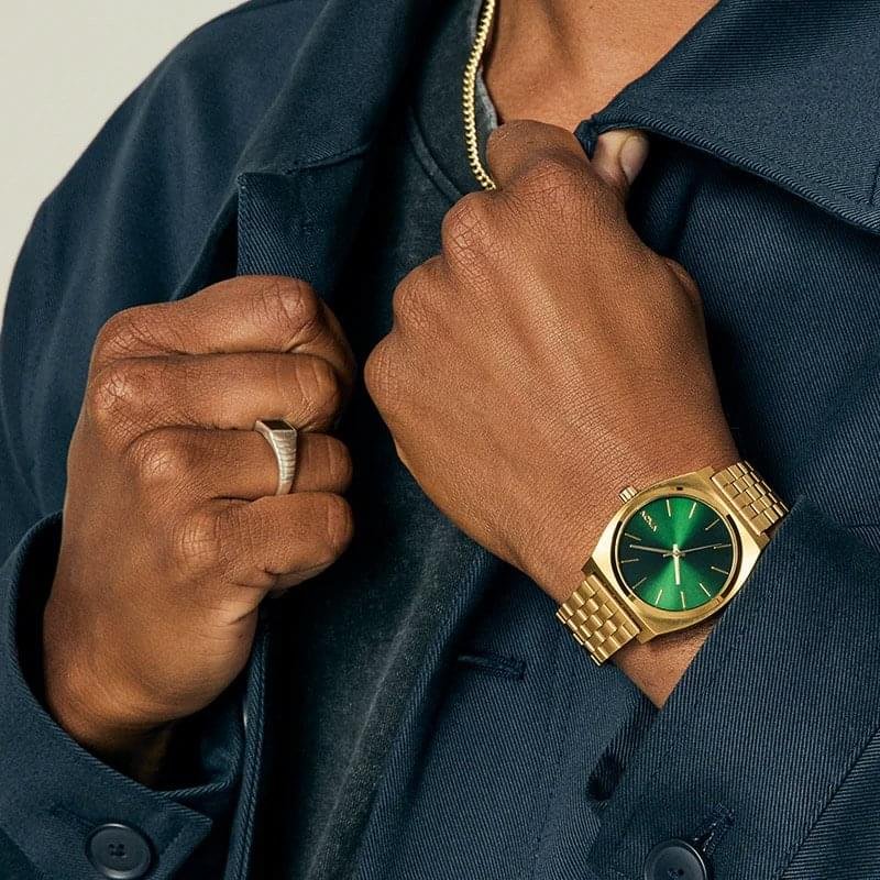 Nixon Time Teller Gold Green Sunray 37mm stainless steel quartz watch with green dial and 100m water resistance.